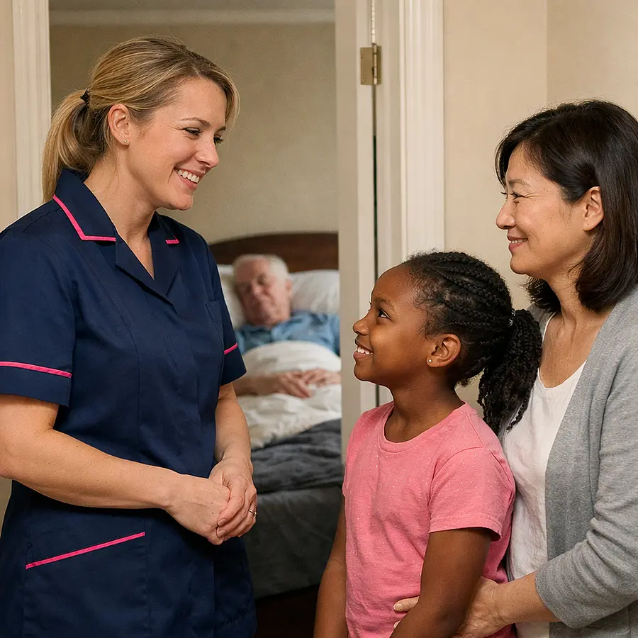 A realistic family home image showing a caucasian female caregiver in a tunic uniform colour 00072b with e51974 accent speaking warmly with a black child and asian adult relative outside a bedroom where an elderly male service user rests gentle smiles respectful and comforting atmosphere